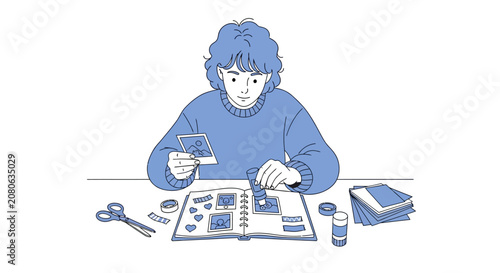 Woman working on collage with scissors.