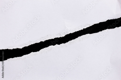 White paper scraps on black background