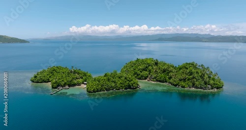 Islands with beach resort in tropical landscape. Bangkay Island. Mindanao, Philippines.