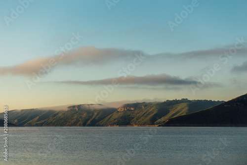 Misty Mountain Landscape with a River at Sunrise