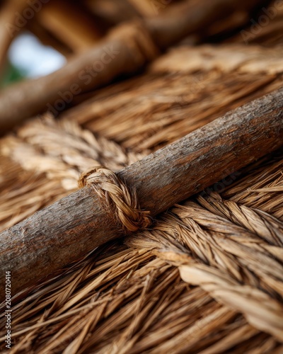 Close-up of woven natural materials, showcasing intricate patterns and textures. The image highlights the craftsmanship of traditional weaving techniques.