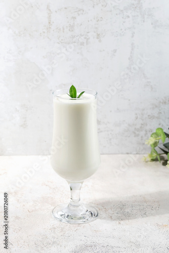 A glass of cold Indian Lassi drink
