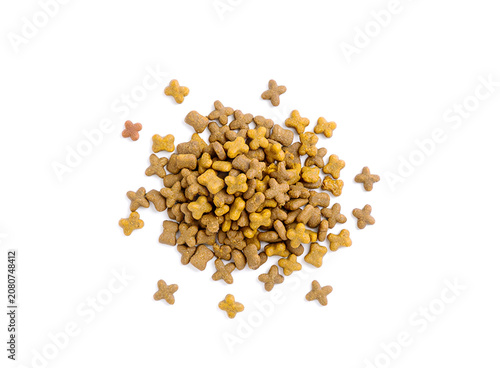 Pile of dry pet food on a white background.