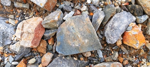 Canvas Print Massive heap of quarry mountain stones for structural building foundations, indu