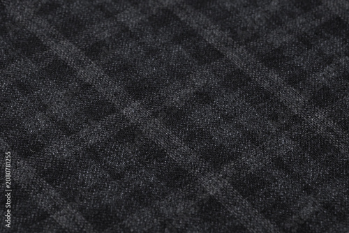 Dark Charcoal Gray Wool Fabric Texture Close-Up Macro with Diamond Argyle Pattern Background