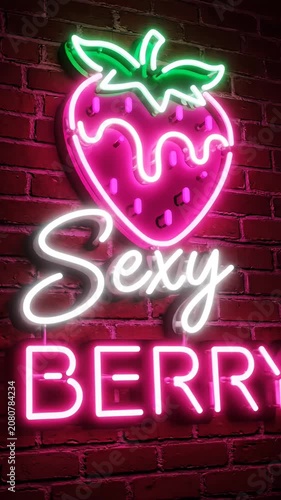Pink neon strawberry sign with sexy berry text.
