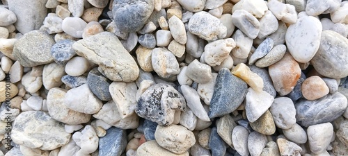 Canvas Print Macro shot of smooth river stones background texture
