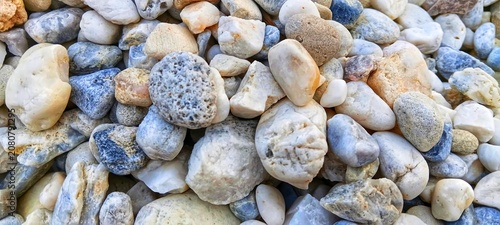 Canvas Print Clean background of small grey river pebbles texture