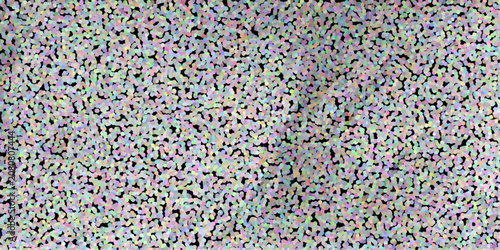 Photos Textured background of numerous small, colorful dots on a black surface with sub