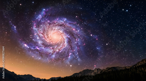 Natural cloud formation a stunning spiral galaxy amidst starry night sky and mountainous landscape