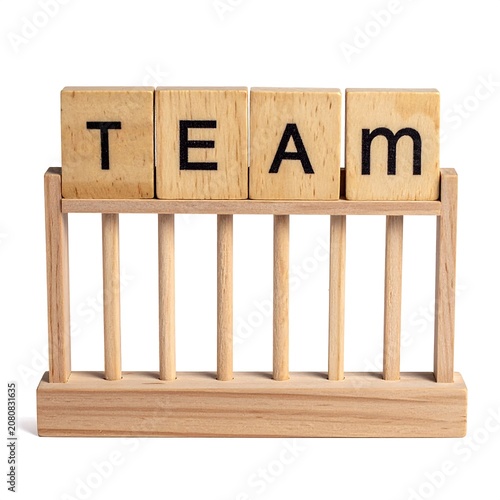 A wooden rack with four letter blocks spelling 'TEAM'
