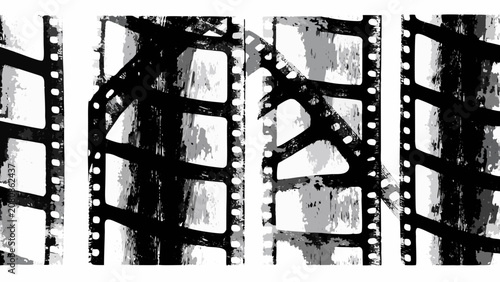 Konstfotografi Distressed filmstrip sections with sprocket holes on a white background a monoch