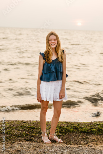 Girl by a lake shore
