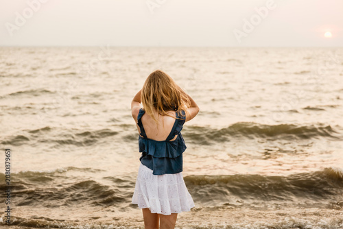 portrait of a girl looking at a lake