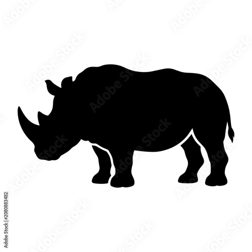 A black silhouette of a rhinoceros stands alone in a plain environment.