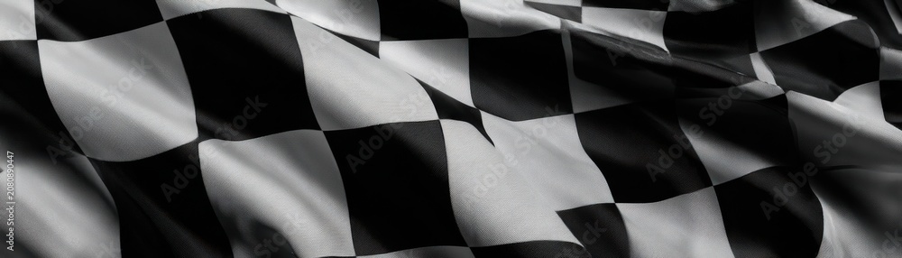 Obraz premium Close-up of Waving Black and White Checkered Racing Flag Texture
