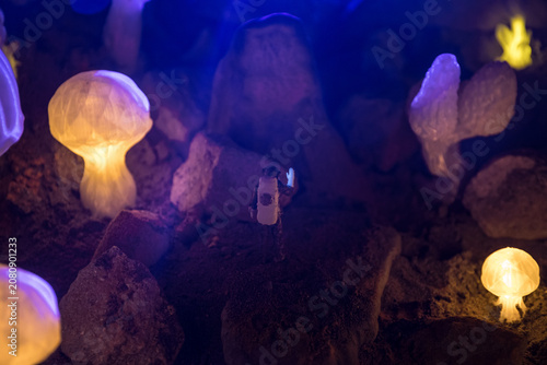 Abstract Miniature of Another Planet with Giant Glowing Mushrooms. A Nighttime Scene on an Alien World, Illuminated by the Soft Glow of Otherworldly Fungi.