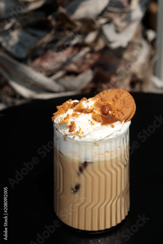 Canvastavla coffee or decaf coffee topped with whipped cream, caramel sauce and lotus biscof