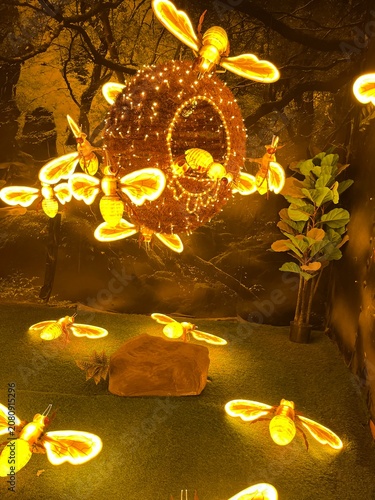 Canvastavla Golden Swarm: Illuminated Bee Hive in an Enchanted Forest