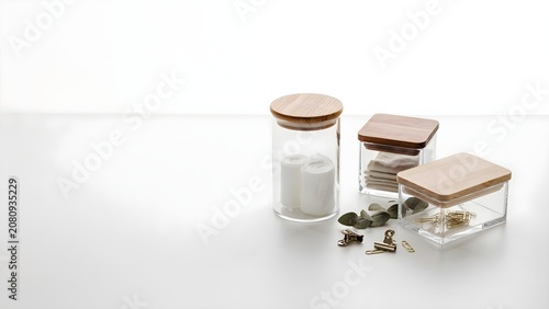 Clear Glass Storage Jars with Natural Wooden Lids on White Background