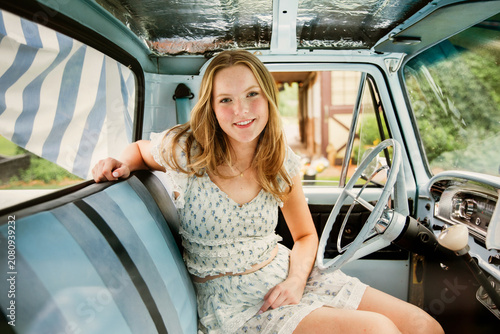 young woman in vintage truck