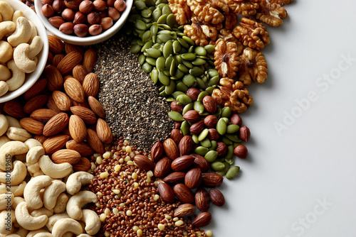 Collection of nuts and seeds on a white surface