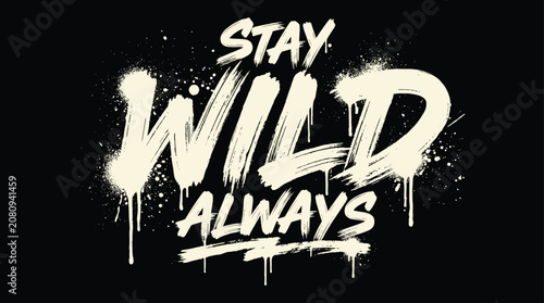 Fotografie Stay wild always text written in a grungy graffiti spray paint style on a solid