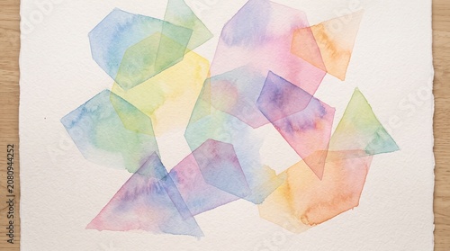 Abstract watercolor painting with colorful overlapping geometric shapes on white textured paper