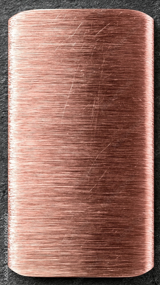 Fototapeta premium Copper plate with brushed scratches on dark surface