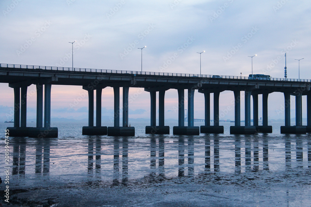 Fototapeta premium Bridge Over Water at Dusk