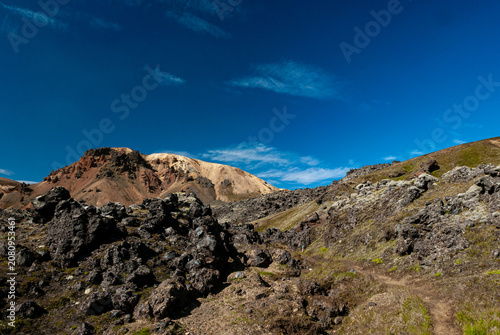 фотографія Lava field in Landmannalaugar Iceland with rugged volcanic rocks colorful rhyoli
