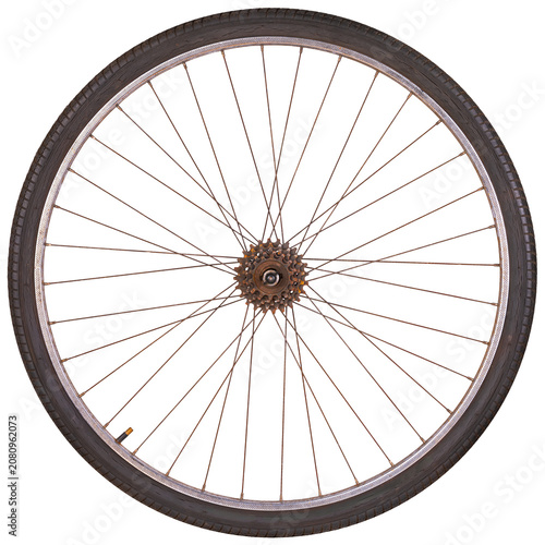 An old bicycle wheel with a steel rim and a small amount of freewheel gear. The rim surface is rusty. Isolated background.