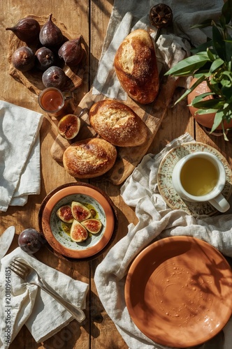 Fresh Pastries and Ripe Figs on a Wooden Table With Tea and Honey for an Afte...
