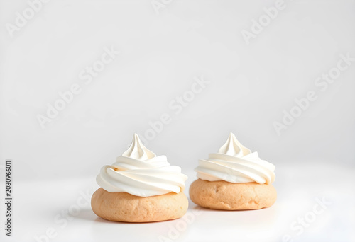Two meringue cookies with w...