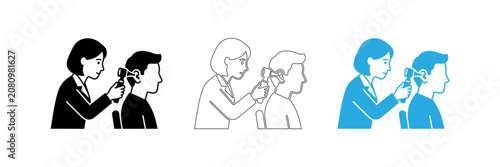 Schilderij op canvas Medical professional examining a patient's ear with an otoscope