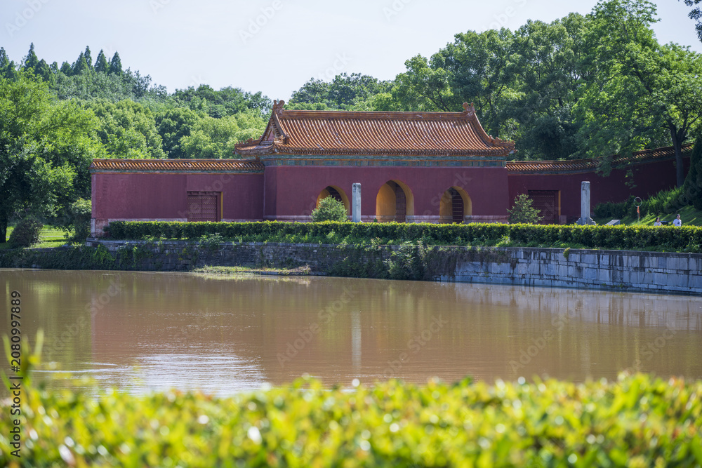 Fototapeta premium Traditional Chinese heritage building by pond at Ming Tombs, Zhongxiang, Hubei, China