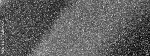 Tableau sur toile Grainy textured noise pattern with speckled gray and white dots on a dark surfac