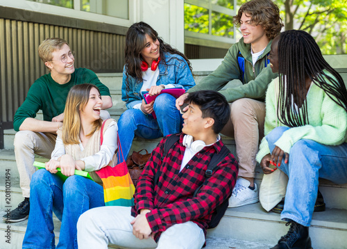 Happy Multiethnic Student Friends Relaxing Together on School Steps Outdoors