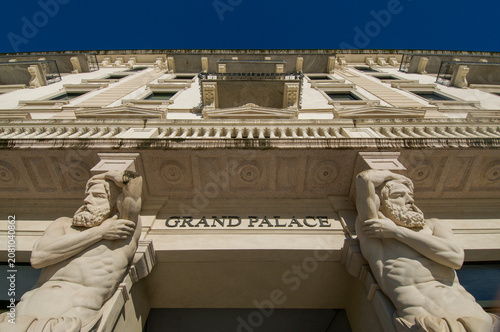 Fotografie Omenoni atlantes statues at Grand Palace entrance in Lugano