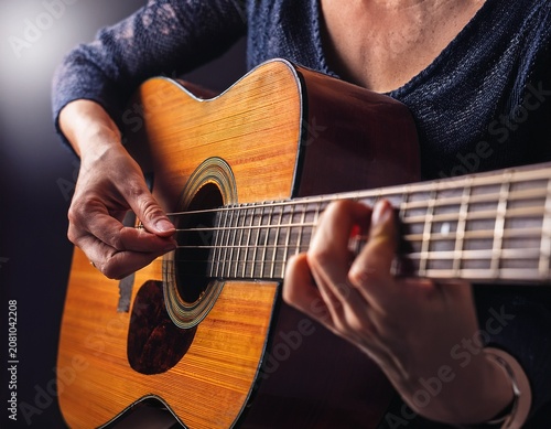 acoustic guitar musician hand finger string fretboard chord close up music weathered musician hand strum acoustic guitar fretboard moody low