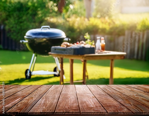 summer time in backyard garden with grill bbq wooden table blurred background