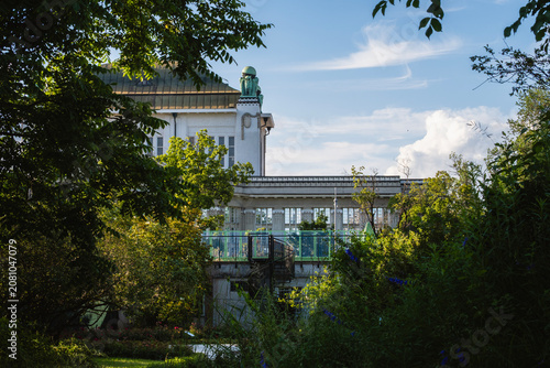 Beautiful owl statues made from cooper, standing on the rooftop of croatian state Archives building observed from the Botanical garden in the Zagreb city,  Croatia