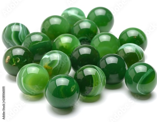 A close-up showcases a collection of vivid green, translucent spheres, seemingly illuminated from within. Each displays unique patterns