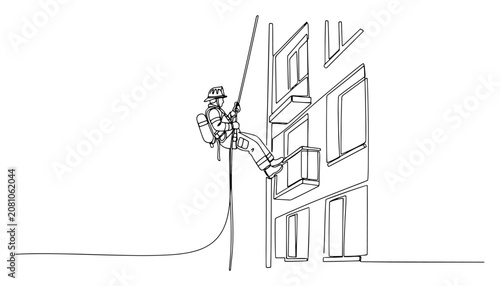 Fotografie Firefighter rappelling down building for high altitude rescue, emergency service