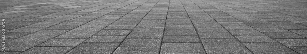 Obraz premium empty stone floor top in perspective. grey tile floor background in perspective view. line. empty copy space stone street. pavement. Granite outdoor tiled floor. gray granite. Marble texture