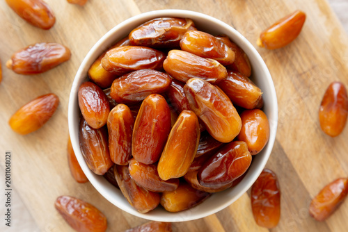 Algerian Dates Deglet Nour in a Bowl, top view. Close-up.