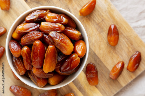 Algerian Dates Deglet Nour in a Bowl, top view. Close-up.