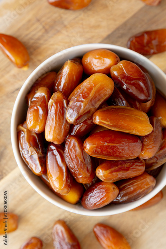 Algerian Dates Deglet Nour in a Bowl, top view. Close-up.