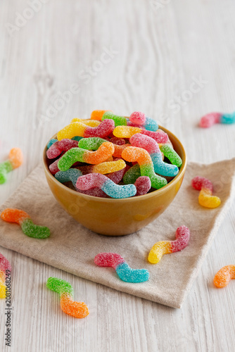 Sugary Sour Gummy Worms in a Bowl, side view.