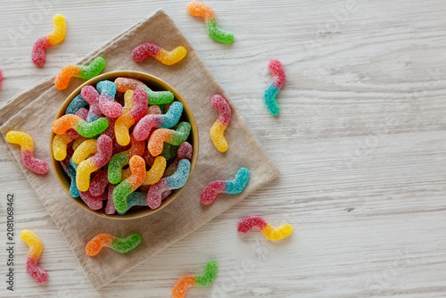 Sugary Sour Gummy Worms in a Bowl, top view. Copy space.